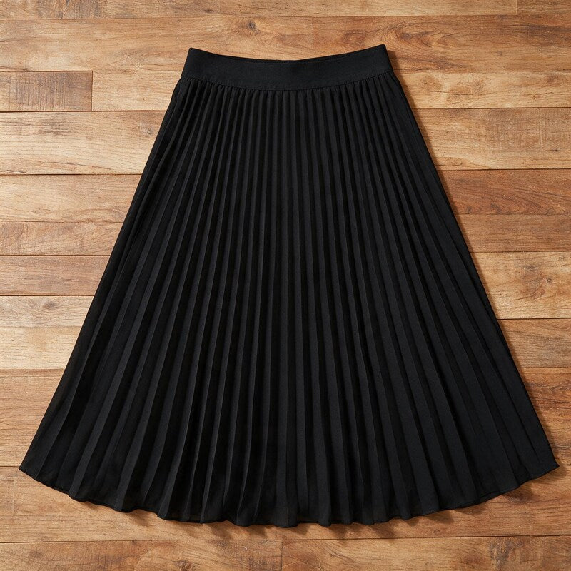 Lucy Melbourne pleated midi skirt in Black – flat lay, pleats visible from above