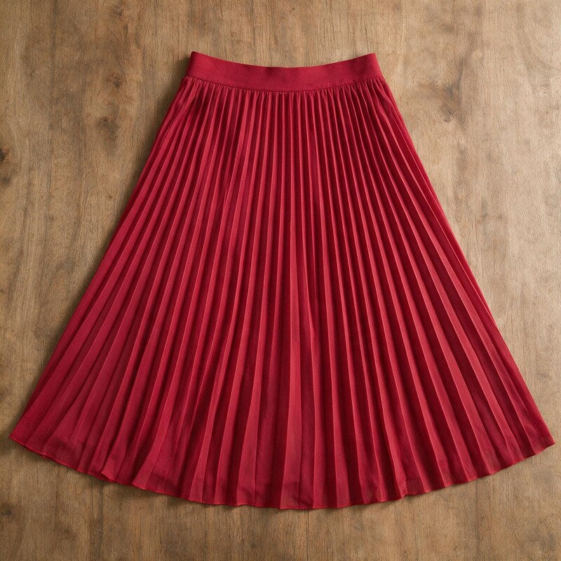 Lucy Melbourne pleated midi skirt in Red – flat lay, pleats visible from above