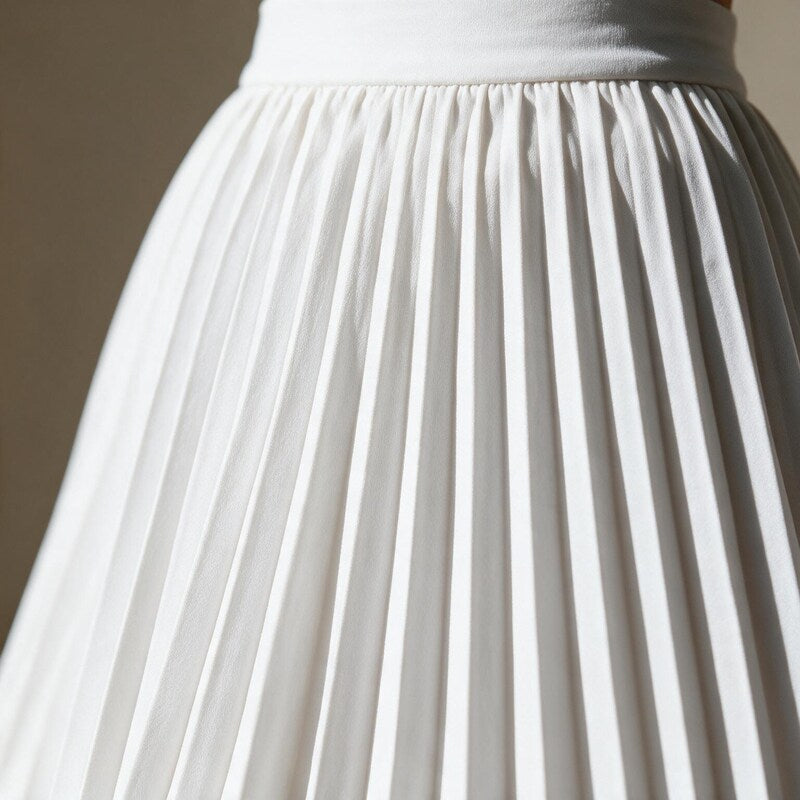 Lucy Melbourne pleated midi skirt in White – close-up detail of waistband and pleats