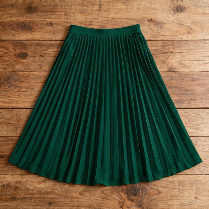 Lucy Melbourne pleated midi skirt in Dark Green – flat lay, pleats visible from above