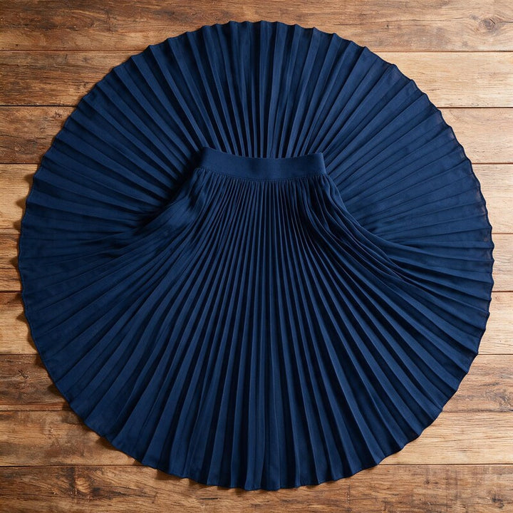 Lucy Melbourne pleated midi skirt in Navy – flat lay, pleats visible from above